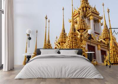 golden spires reaching toward the sky on buddhist temple in bangkok thailand Wall mural