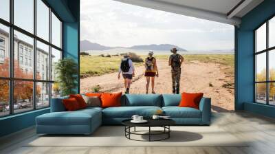 hikers in the namibia desert towards the mountains Wall mural