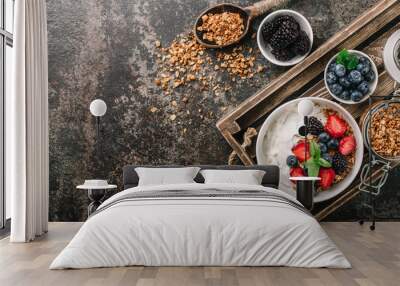 Healthy breakfast with granola, yogurt, fruits, berries on dark metal background. Summer homemade breakfast. Wall mural