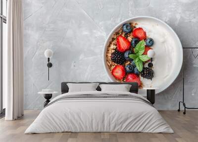 Healthy breakfast with granola, yogurt, fruits, berries on white background. Wall mural