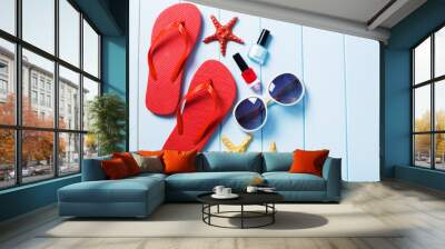 Red step-ins on blue wood background. Wall mural