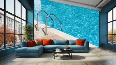 Clear turquoise water in the outdoor swimming pool and railings. Wall mural