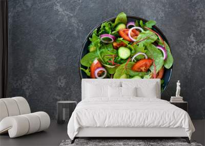 Green vegan salad from green leaves mix and vegetables. Top view Wall mural