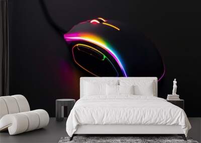 A computer mouse with a colorful light on it Wall mural