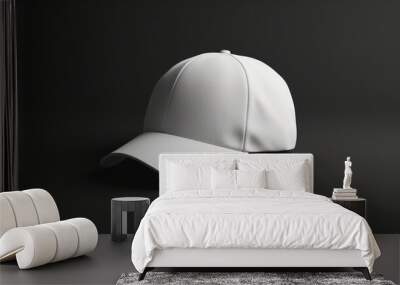 A white hat is sitting on a dark surface Wall mural