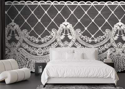 White lace on black background isolated horizontally. Macro Wall mural