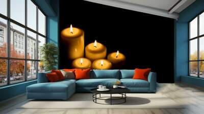 Burning candle in darkness Wall mural