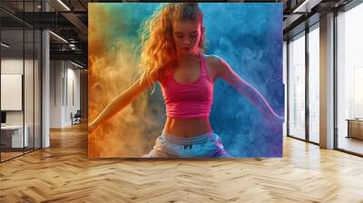 Young woman dancing hip-hop in bright cloud colorful dust background. Colorful portrait of a young woman dancing. Female dancers performing street dance on colourful background Wall mural