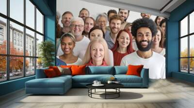 Cheerful international happy friends are having fun taking selfies. Large group of happy multiethnic and multi-generation people.  Wall mural