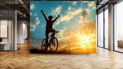 cyclist silhoutte with bicycle raised to sky race and victory concept  Wall mural