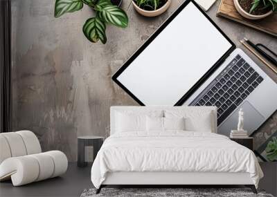 On the table, a smartphone and a laptop with a blank screen. top view Wall mural