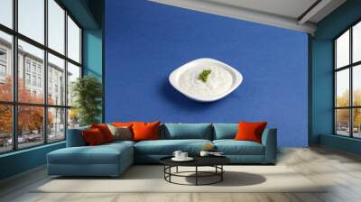 Set of different tasty sauces in bowl with sauce isolated on blue background top view. Wall mural