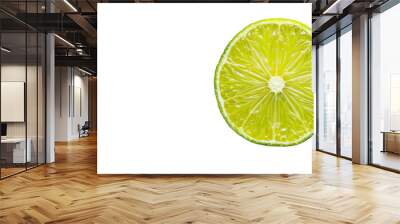 A single slice of lime placed on a plain white surface, showcasing its vibrant green color and citrus texture Wall mural