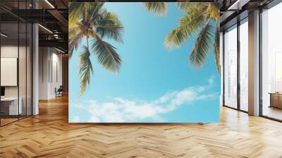 Blue sky and palm trees view from below, vintage style, tropical beach and summer background, travel concept Wall mural