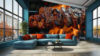 Tasty meat on spit on fire Wall mural