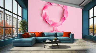 Gender Venus symbol made of beautiful flower petals on candy pink background, woman sign Wall mural