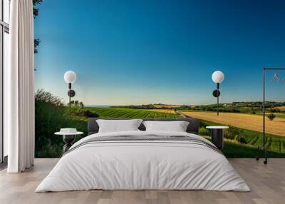 Beautiful sunrise in the countryside of Marche in a summer morning Wall mural