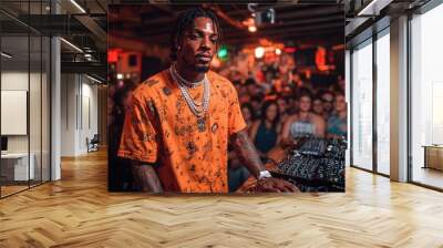 Dj mixing at a party with crowd of people in background Wall mural