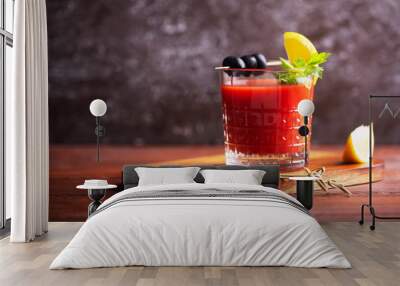 Cocktail Bloody Mary with ice, salt and snacks in glass on a wooden table Wall mural