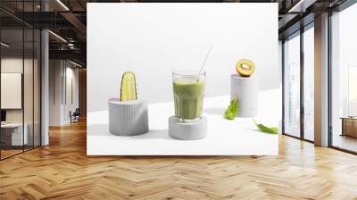 Green diet concept still life with cucumber, kiwi and smoothie, spinach Wall mural