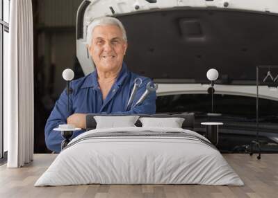 Mechanic in an automotive workshop Wall mural