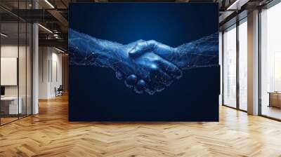 A handshake isolated on a blue background is a concept of relationships, teamwork, partnership deals, businessman cooperation, corporate meetings, contracts, friendship and business agreements. Wall mural