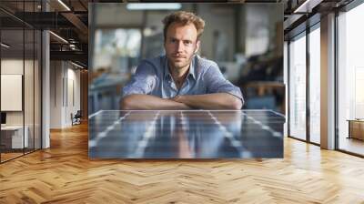 An office portrait of a businessman leaning against a solar panel Wall mural