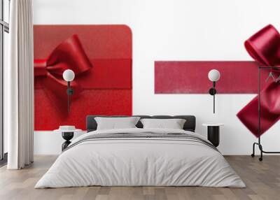 Isolated white background with a red ribbon bow on a gift card Wall mural