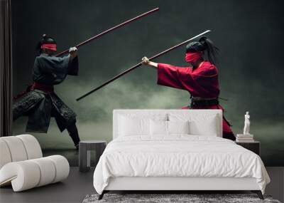 Raster illustration of battle of two samurai. Training martial arts to two Asian men with long hair, one in a black kimono, the other in a red one. Stick, sword duel. 3d rendering artwork Wall mural