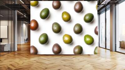 The fruit is high in vitamin and nutrients and is a summer refreshment, the avocado pattern offers a flat lay view with half slices isolated on the background. Wall mural