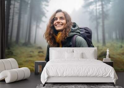 The girl is enjoying a hike in the forest Wall mural