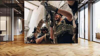 Low angle view of brave soldiers in uniforms preparing for battle. Wall mural