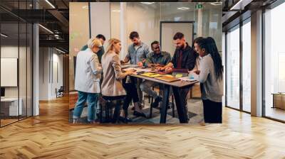 Multiracial business team working together and having a meeting in the office Wall mural