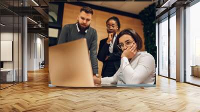 Stressed business team having a meeting in the office and solving a problem Wall mural