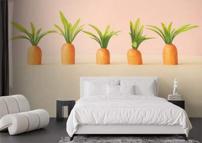 Carrots on pastel yellow. Minimal Easter concept. Spring minimal composition. Wall mural