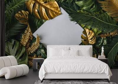 Creative nature background. Gold and green tropical palm leaves. Minimal summer abstract jungle or forest pattern. White paper frame copy space. Wall mural