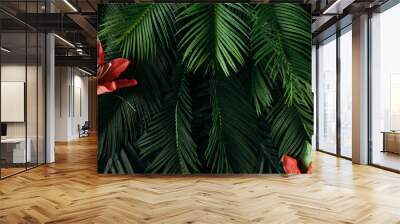 Creative nature layout made of tropical leaves and flowers. Flat lay. Summer concept. Wall mural