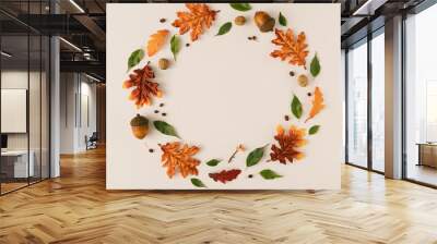 Creative season layout of colorful autumn leaves and branches. Nature mockup background. Seasonal concept. Flat lay wreath. Wall mural