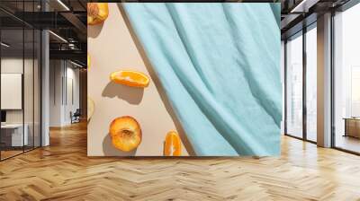 Summer scene with fresh slices of fruit and blue beach towel. Minimal aesthetic. Wall mural