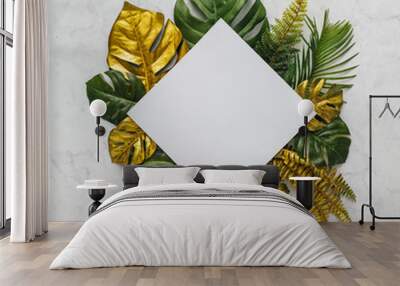 top view of green and gold tropical leaves on white marble background. flat lay. minimal summer conc Wall mural