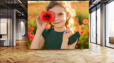 Girl in dress and straw hat outdoor At Poppy Field Wall mural