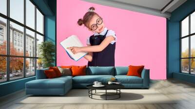 primary school girl in uniform, round glasses without lenses hol Wall mural