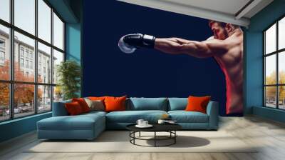 shirtless boxer with gloves on dark background. Isolate Wall mural