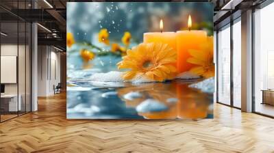 Two orange candles burn softly beside vibrant yellow flowers in a tranquil water setting. Bubbles float, enhancing the peaceful atmosphere and inviting relaxation Wall mural