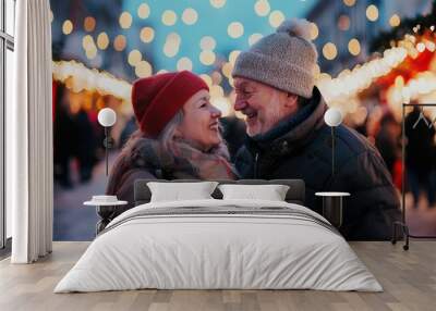 senior couple having fun at a Christmas market Wall mural