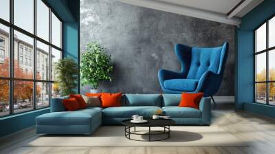 Bright living room with a blue stylish armchair against a gray plaster wall,  Wall mural