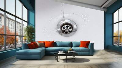 water flowing from faucet into sink drain Wall mural