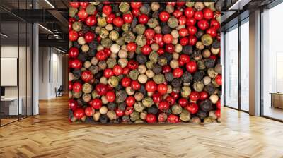 A mixture of different peppercorns white, black, red and green peppers spices. Wall mural