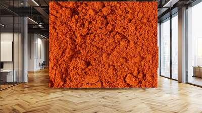 Ground paprika, red terracotta spice background, art in cooking. Wall mural