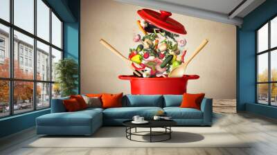 Big red pot for soup with vegetables Wall mural